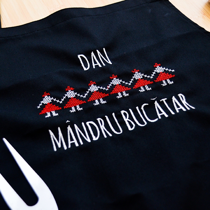 Customised apron with traditional embroidery on black