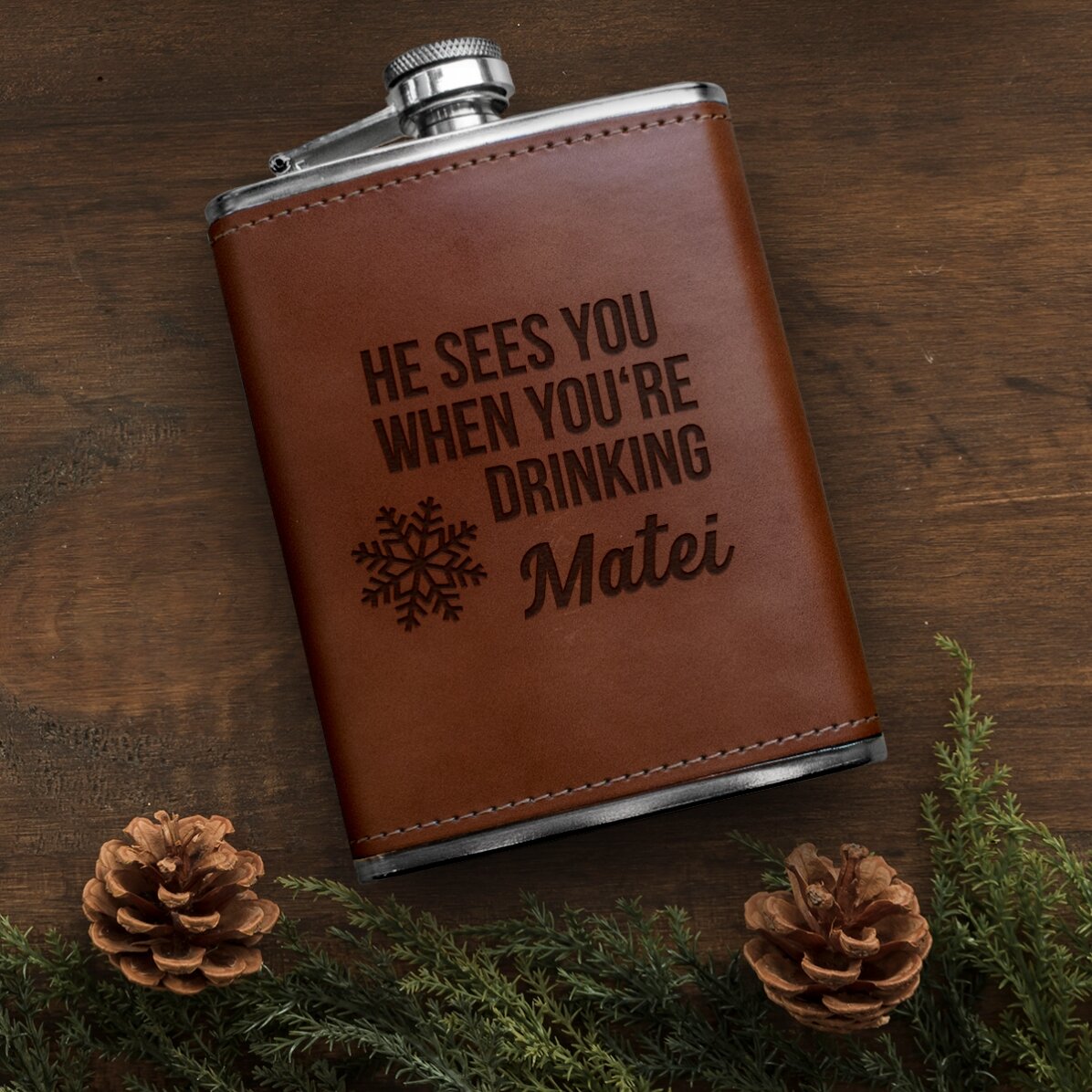 Personalised leather-covered hip flask - He sees you when you